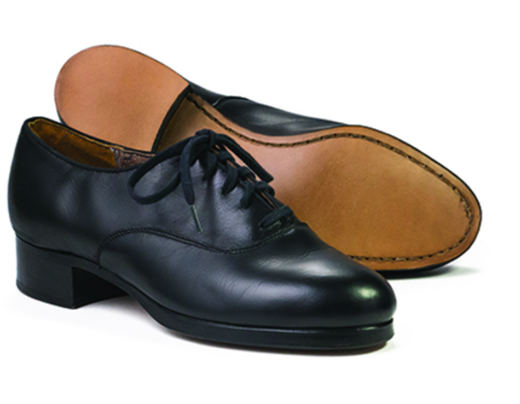 A pair of black leather lace-up dance shoes featuring tan leather soles, small block heels, and visible welt stitching displayed on a white background