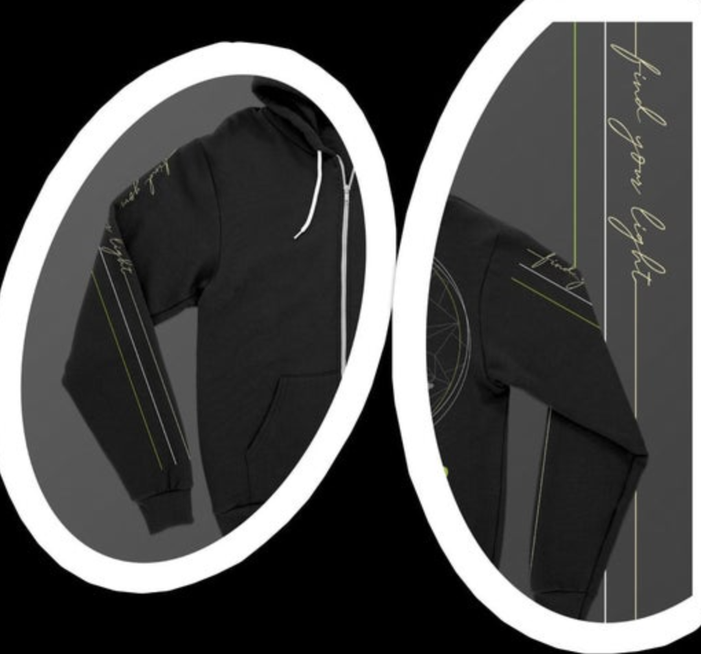 Black full-zip hoodie with white zipper and drawstrings, featuring cursive "find your light" text vertically on the left sleeve alongside white and lime green stripes, and a subtle geometric wheel graphic with smaller matching text and stripes on the right sleeve