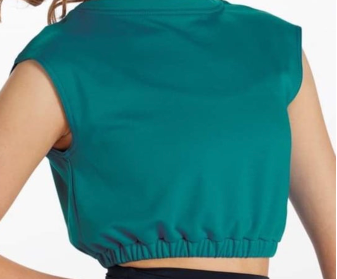 Back view of a person wearing a dark turquoise sleeveless crop top with an elasticized hem
