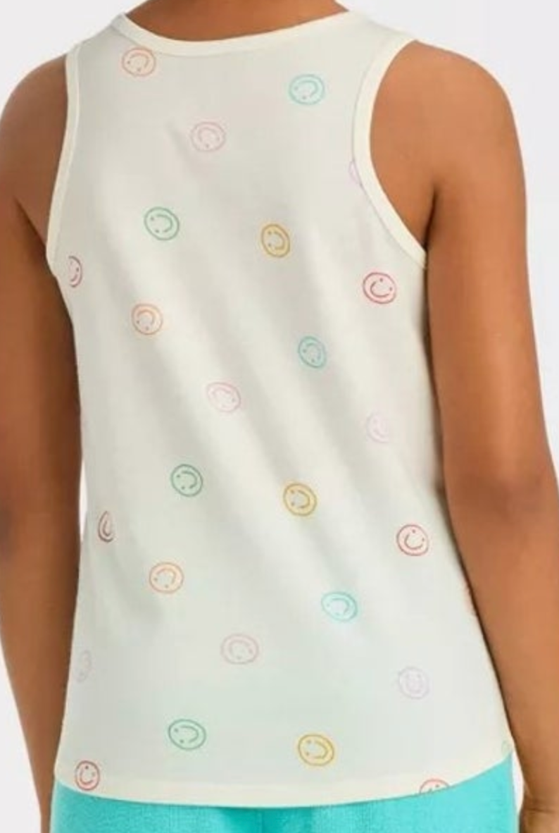 A person from behind wearing a cream sleeveless tank top adorned with scattered pastel outlined smiley faces and teal shorts
