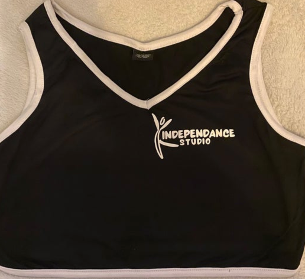 A black v-neck crop top with white trim and a white "Independance Studio" logo featuring a stylized dancer figure