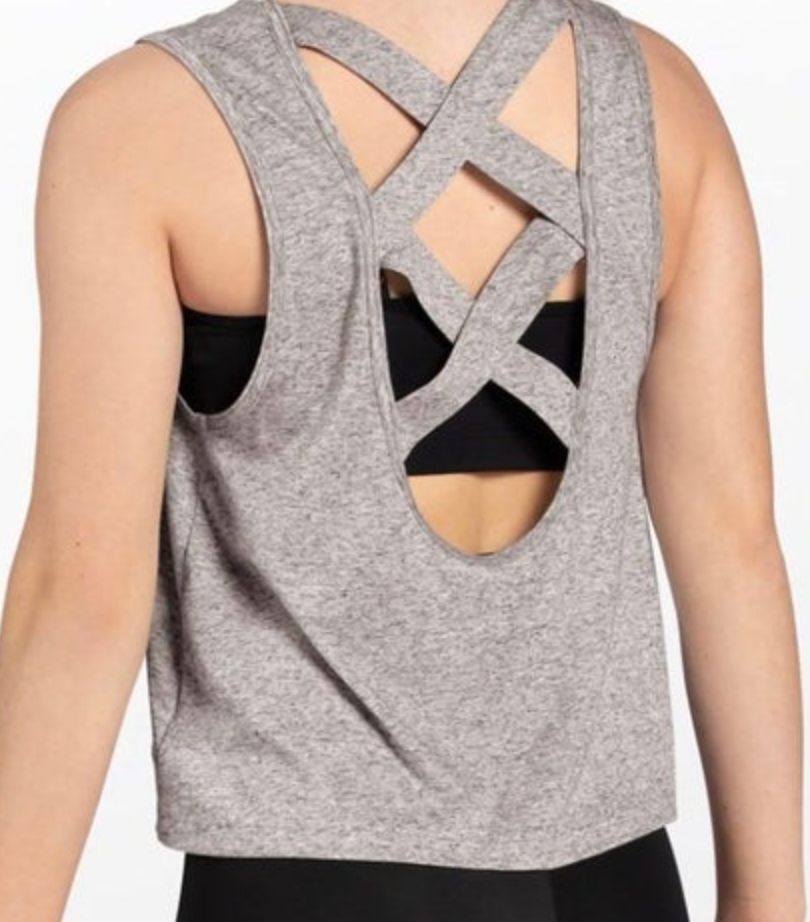 Back view of a person modeling a grey heathered tank top featuring criss-cross back straps and a large oval cut-out exposing a black sports bra