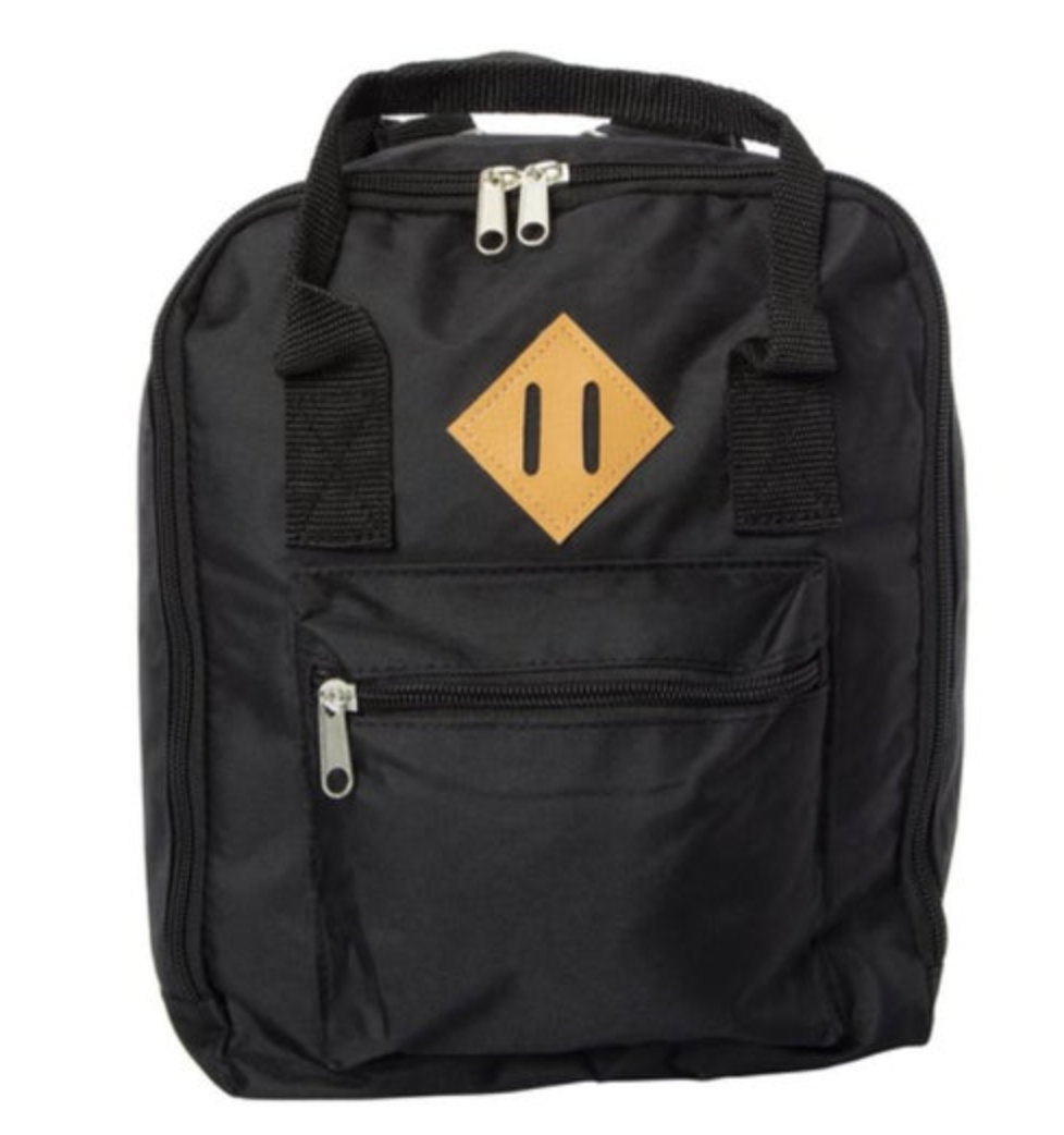 Black fabric mini backpack featuring a tan diamond patch with two vertical black slits, silver top and front pocket zippers, and a black top carry handle on a white background