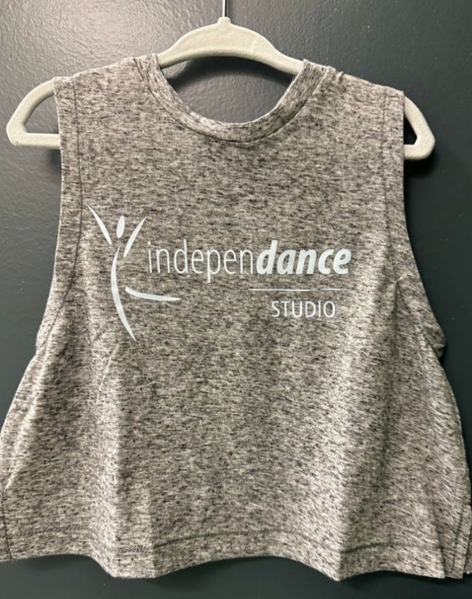 Grey heathered crop top from Independance Studio featuring a white stylized dancer logo and text, displayed on a grey plastic hanger