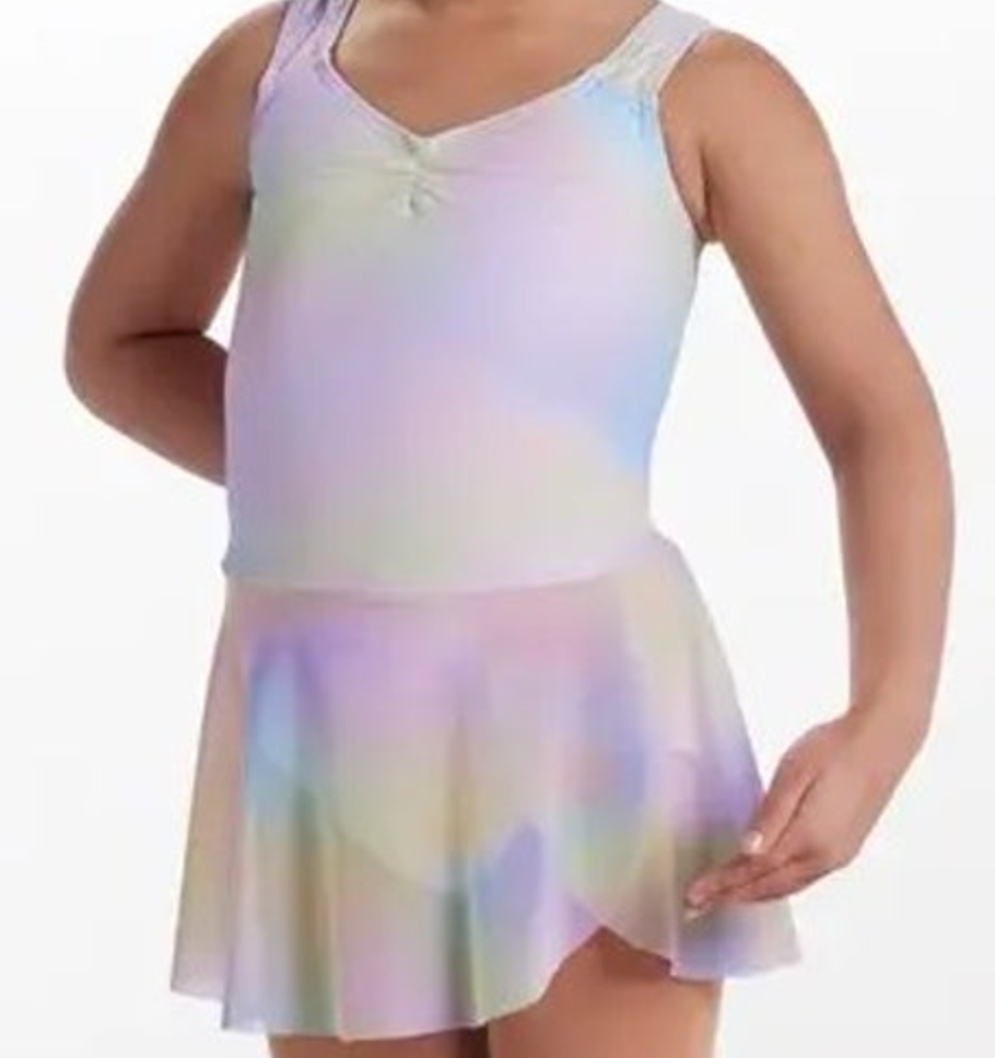 A young dancer on a white background wearing a pastel tie-dye v-neck ruched leotard and a coordinating sheer wrap skirt
