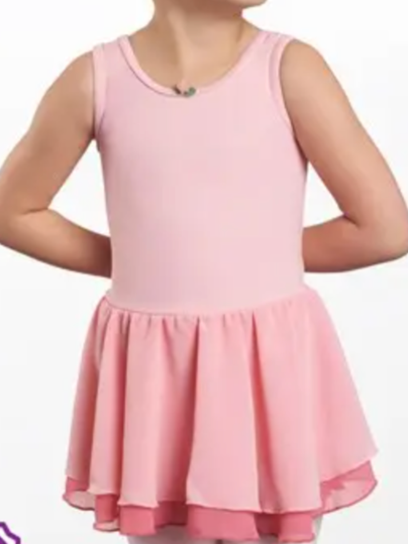 Young dancer in a light pink sleeveless leotard with an attached tiered ballet skirt in two shades of pink and a small green bow detail at the neckline