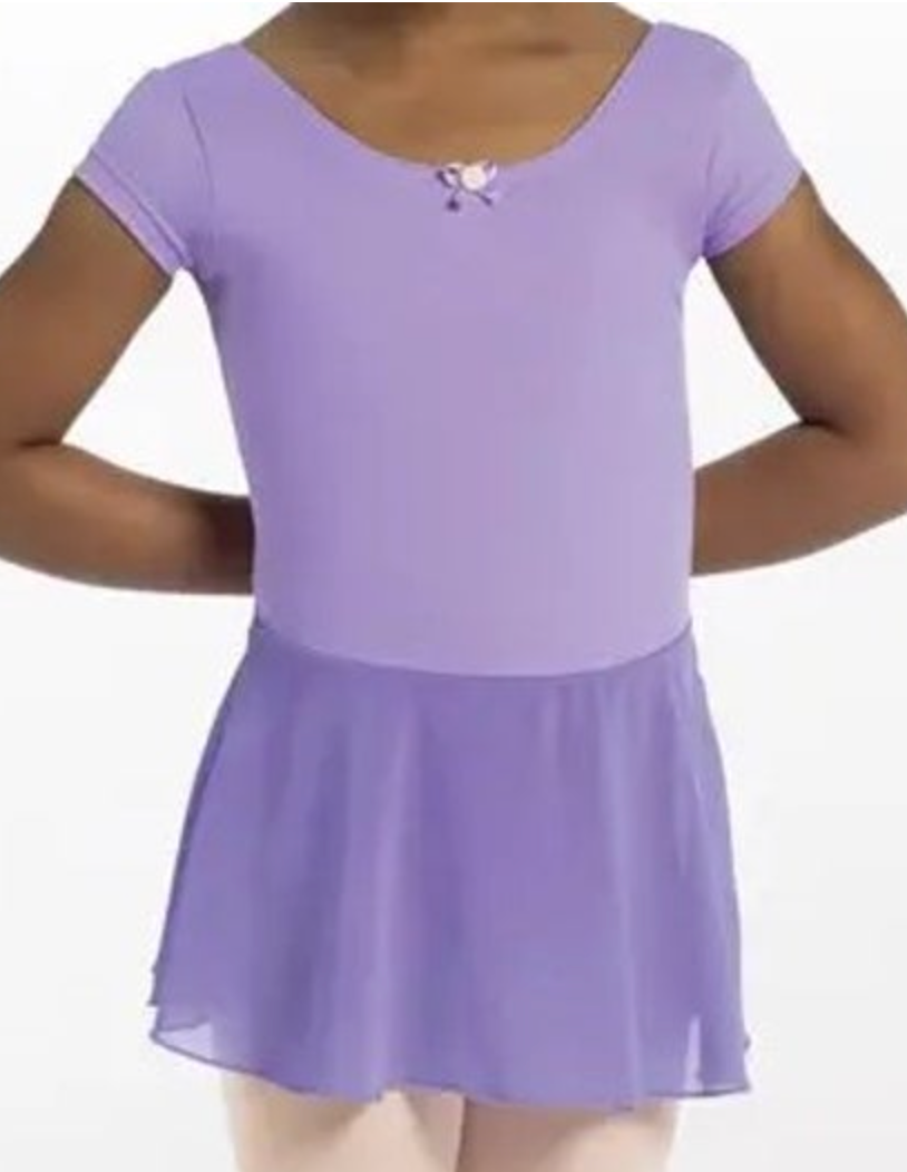 Photograph of a child model wearing a lavender short-sleeved leotard with a matching flowing chiffon skirt and a delicate pink rosette bow on the scooped neckline