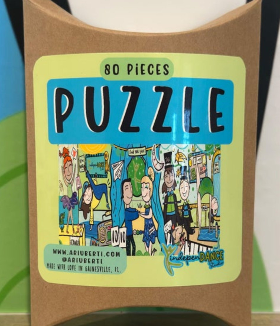 ARIUBERTI illustration on an 80-piece puzzle box label depicting a vibrant dance party with colorful cartoon characters doing various dance moves a DJ booth with a boombox and the YindepenDANCE Studio logo